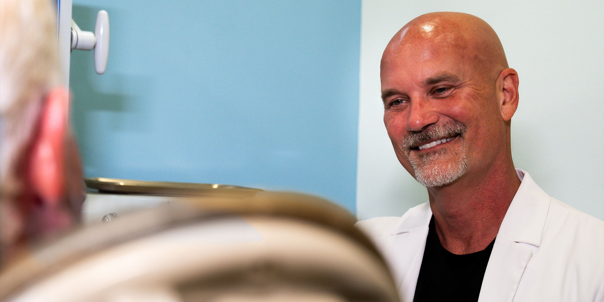 Doctor Smiling at Patient