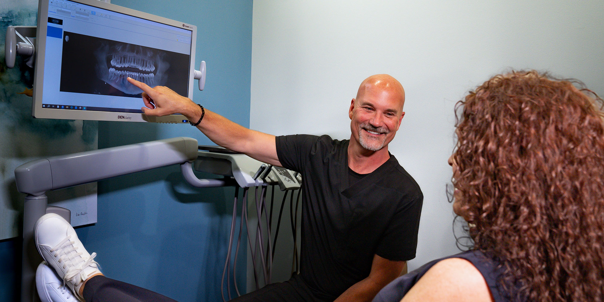 Doctor Pointing a dental x-ray