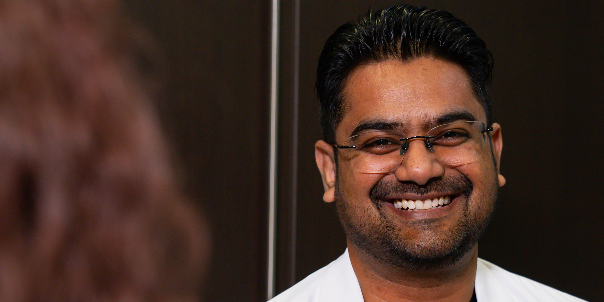 Doctor Smiling at Patient