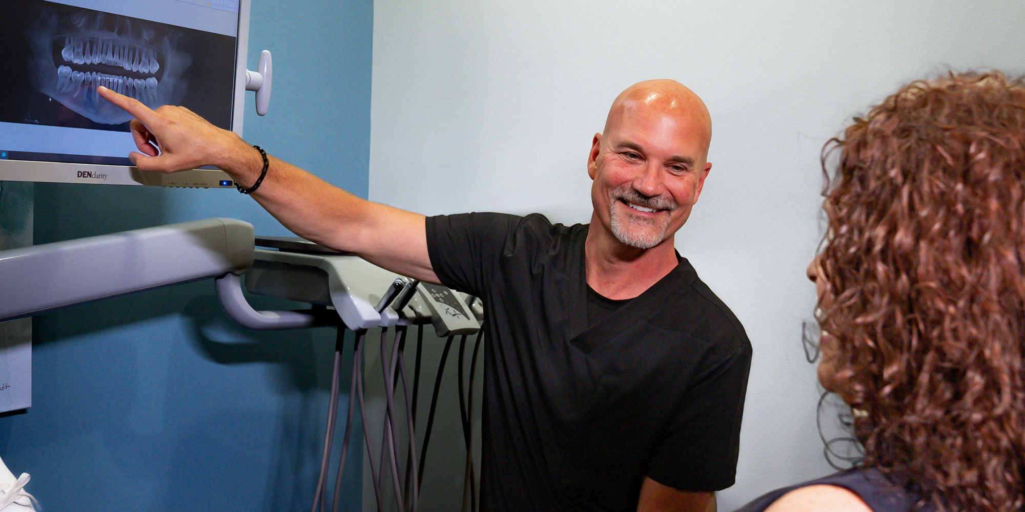 doctor going over dental procedure information
